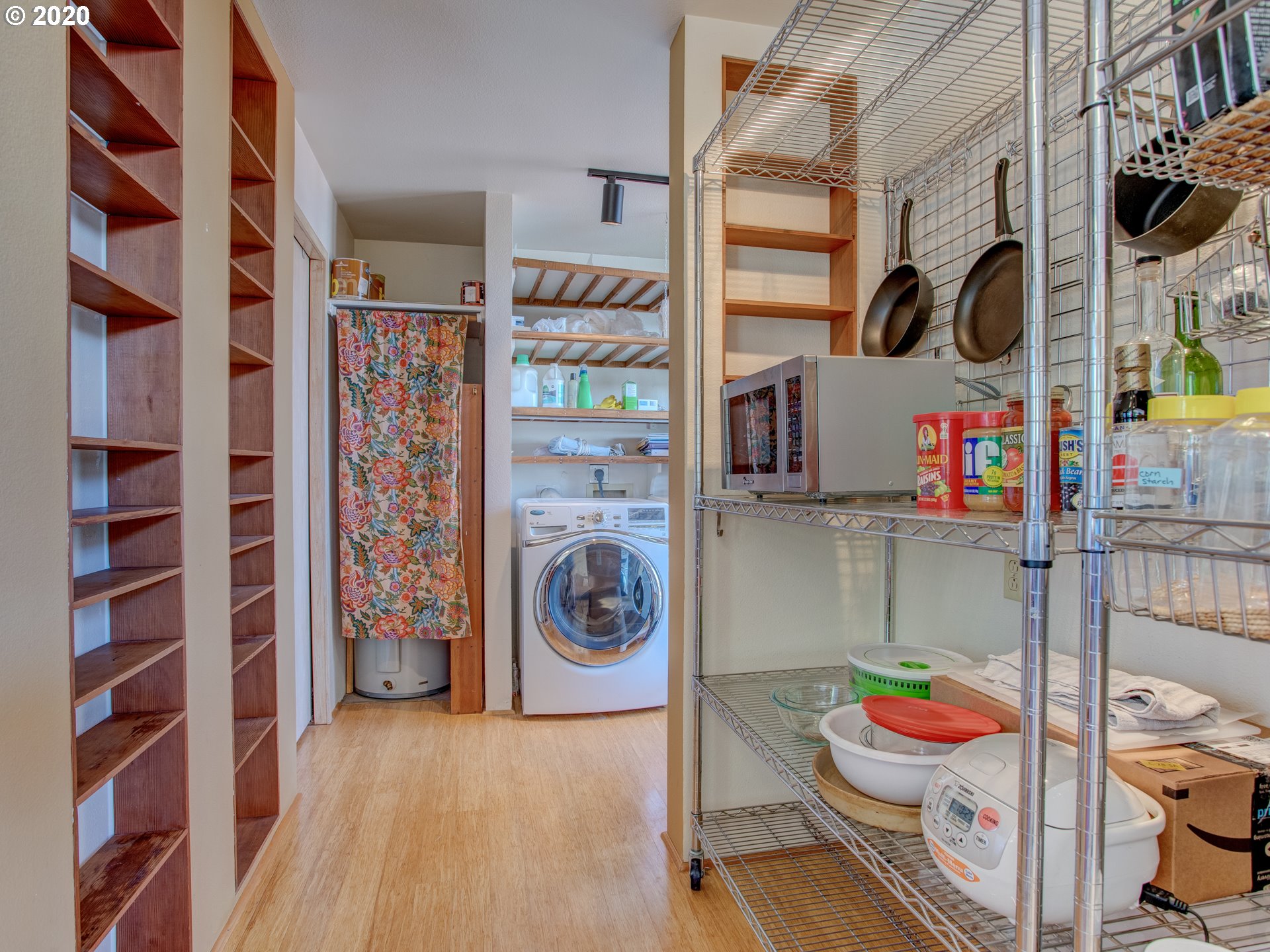 14998 Northwest Mill Road, Unit D Portland, OR 97231 - Photo 13 of 32 a utility room with fridge dryer and washer