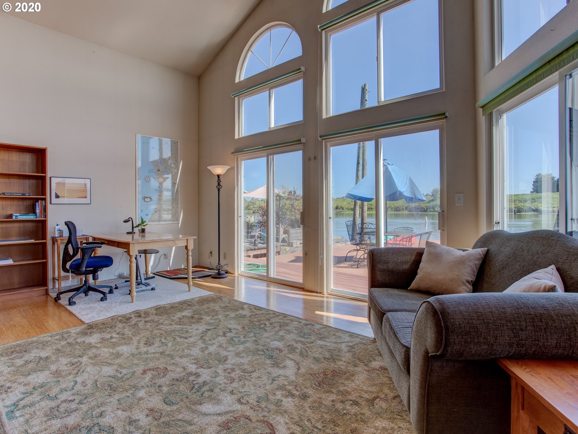 14998 Northwest Mill Road, Unit D Portland, OR 97231 - Photo 20 of 32 a living room with furniture and a large window