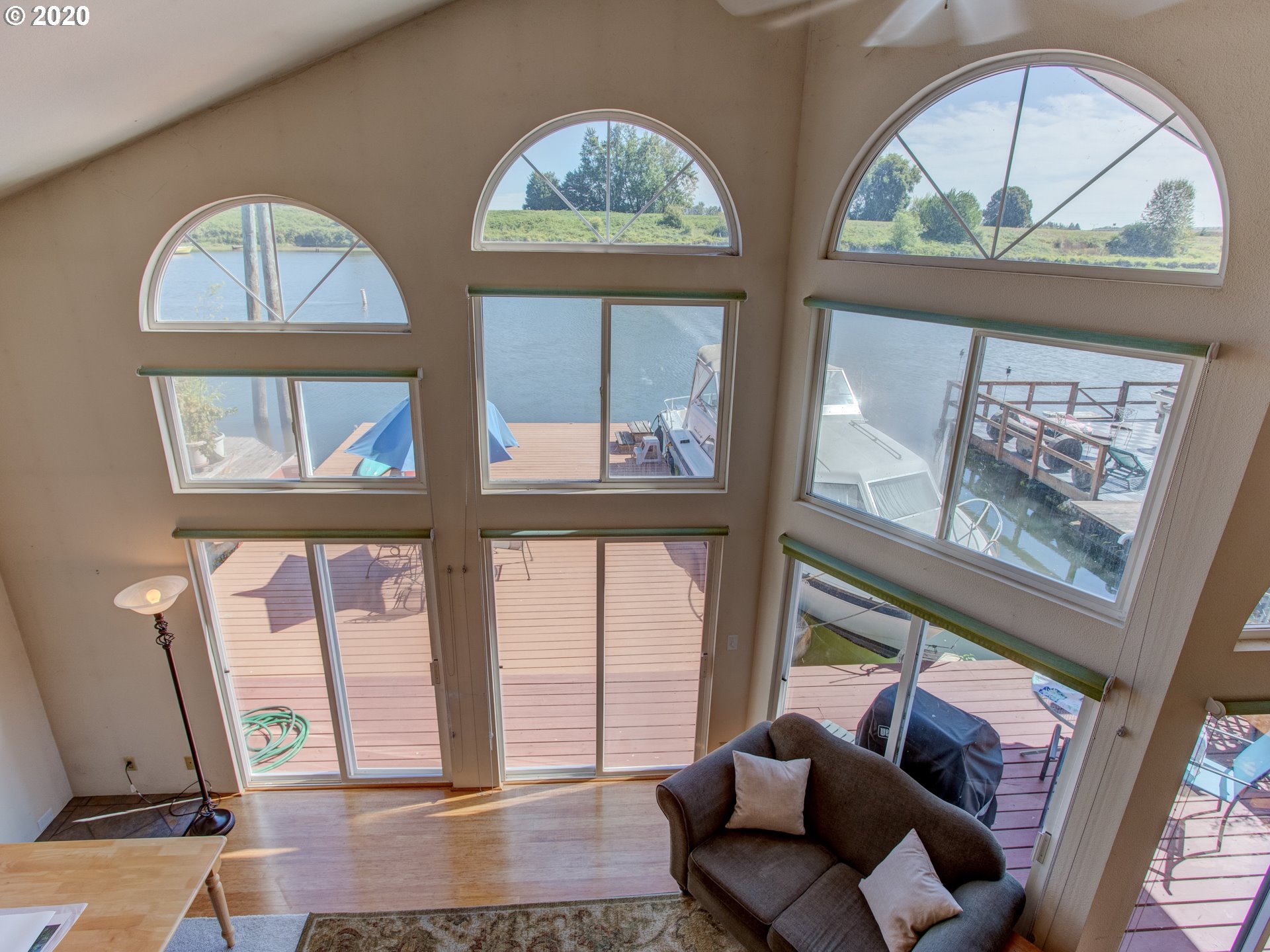 14998 Northwest Mill Road, Unit D Portland, OR 97231 - Photo 25 of 32 a living room with furniture and a large window