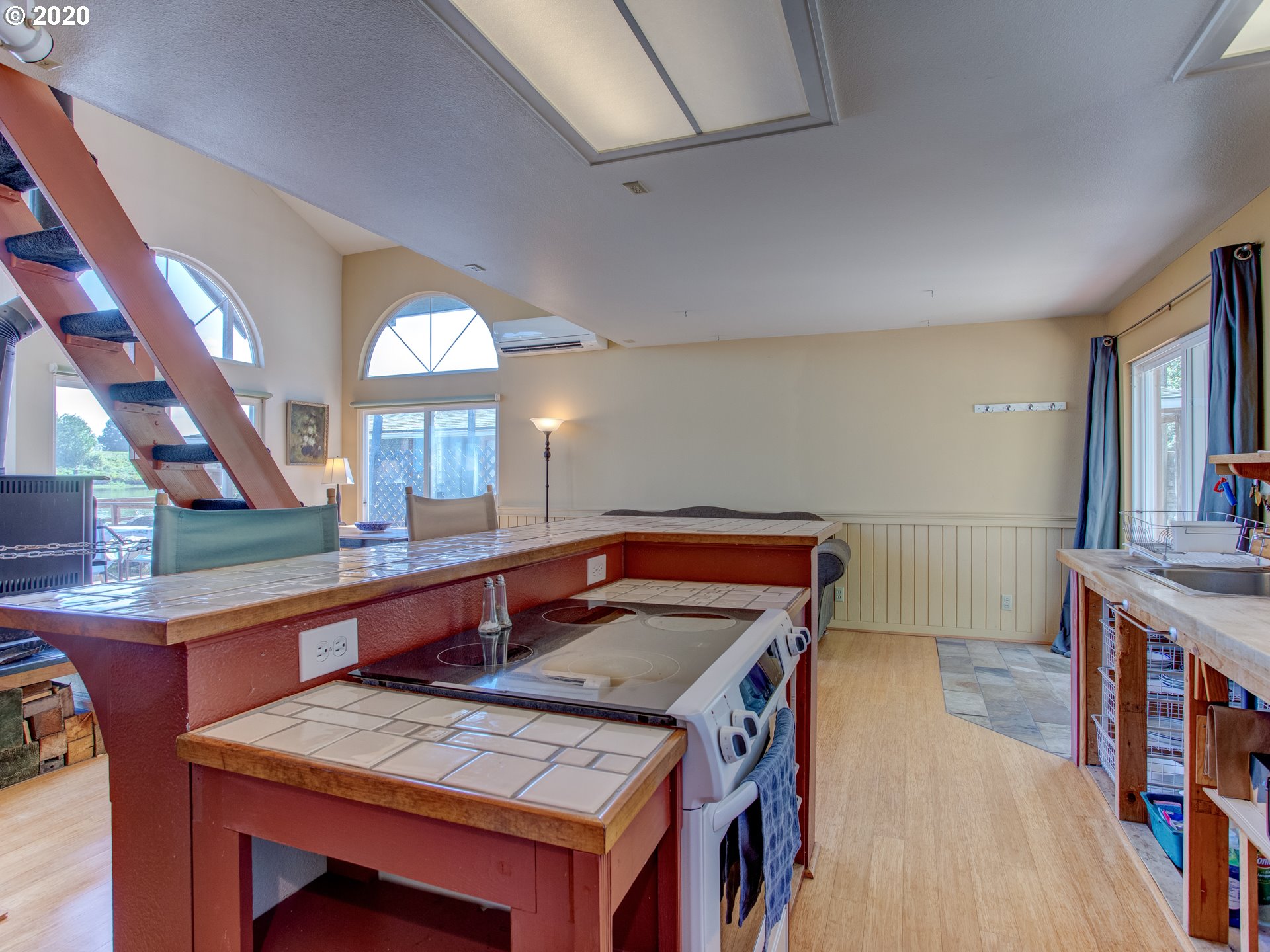 14998 Northwest Mill Road, Unit D Portland, OR 97231 - Photo 9 of 32 a room with furniture and a table