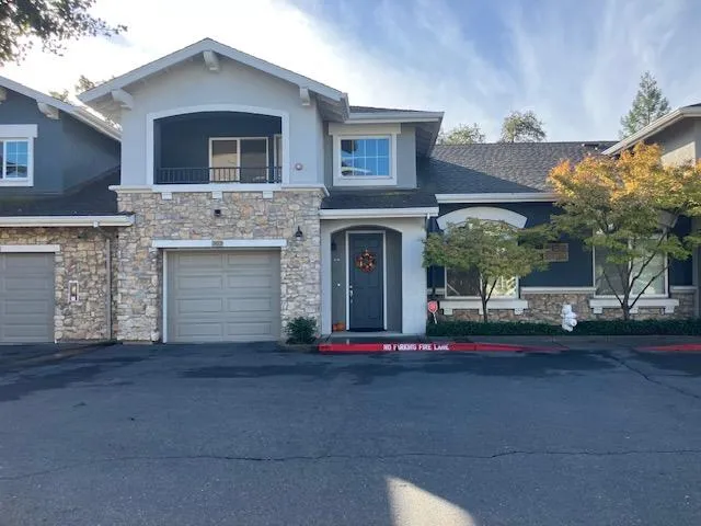 a view of a house with a street