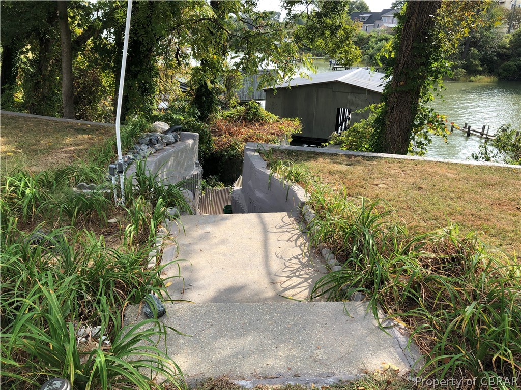 122 Cox Landing Road Topping, VA 23169 - Photo 24 of 32 Concrete Steps down to Double Boathouse