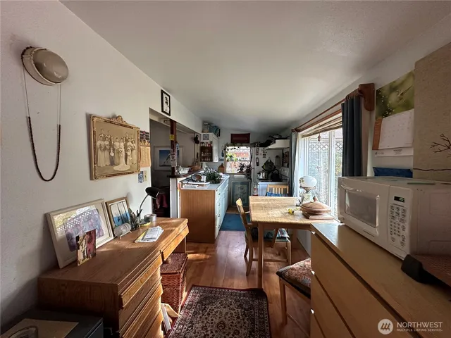 a view of a dining room with furniture window and wooden floor