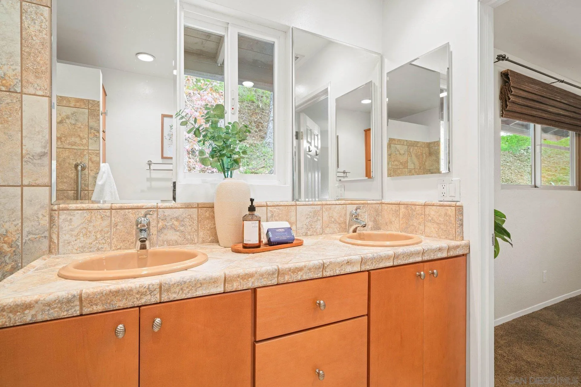 15770 Oak Valley Road Ramona, CA 92065 - Photo 13 of 28 a bathroom with a granite countertop sink and a mirror