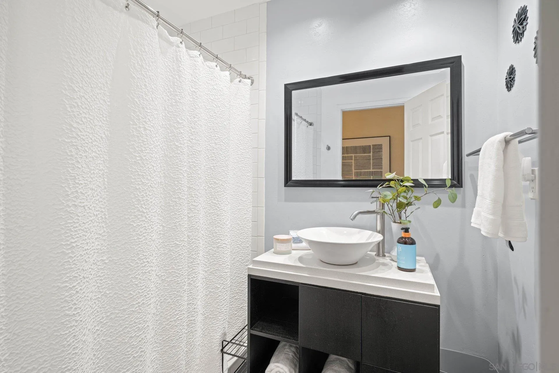 15770 Oak Valley Road Ramona, CA 92065 - Photo 15 of 28 a bathroom with a sink vanity and a mirror