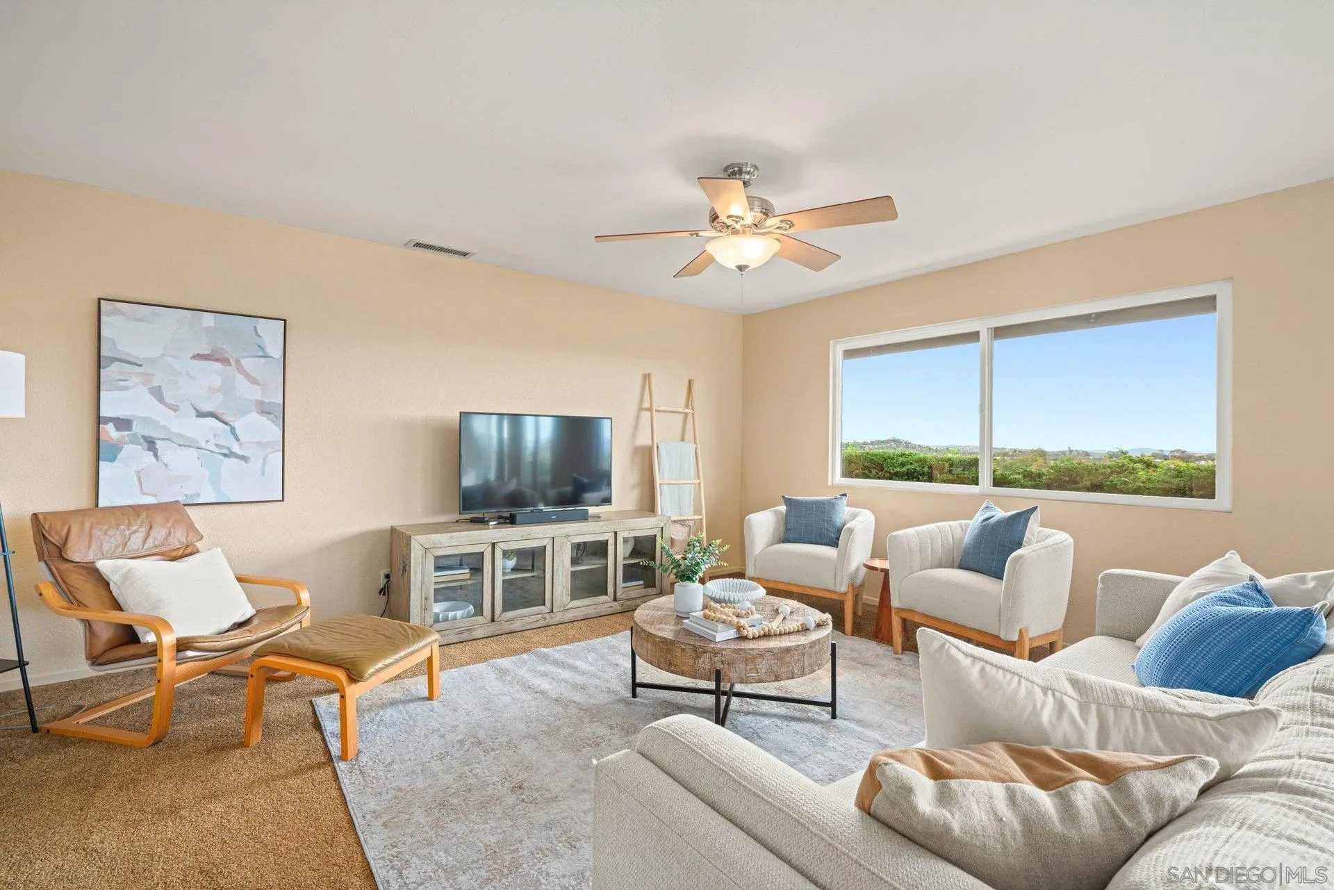 15770 Oak Valley Road Ramona, CA 92065 - Photo 2 of 28 a living room with furniture and a flat screen tv