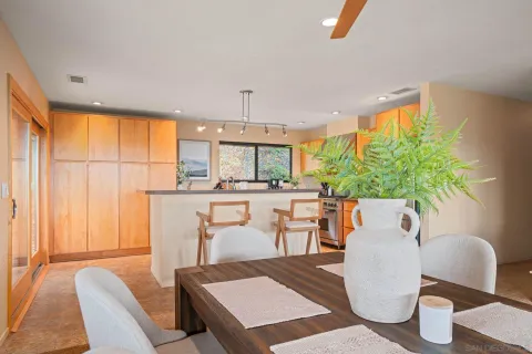 a view of a dining room with furniture window and outside view