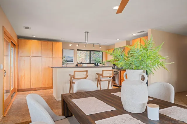 a view of a dining room with furniture window and outside view