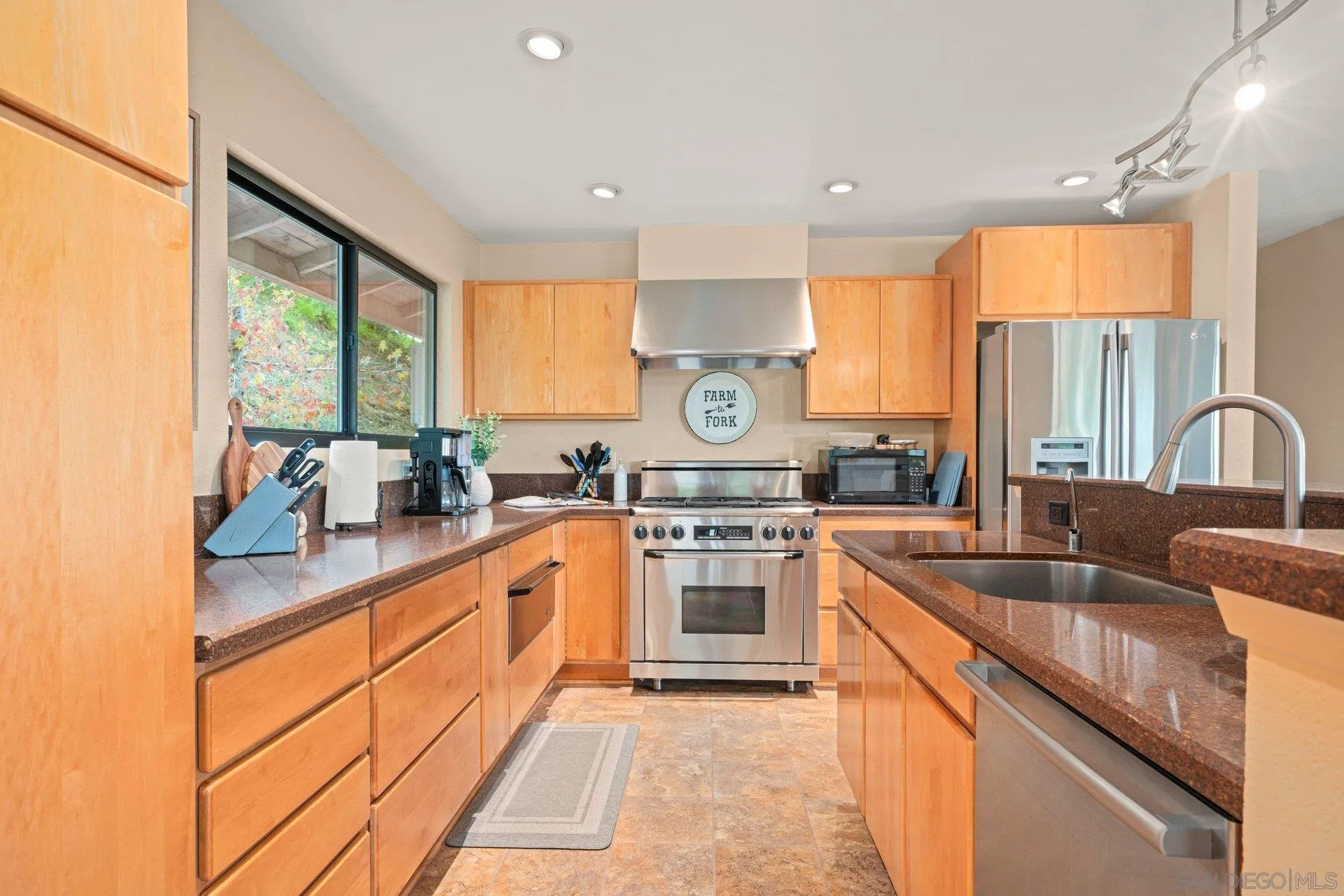 15770 Oak Valley Road Ramona, CA 92065 - Photo 8 of 28 a kitchen with stainless steel appliances granite countertop sink stove and refrigerator