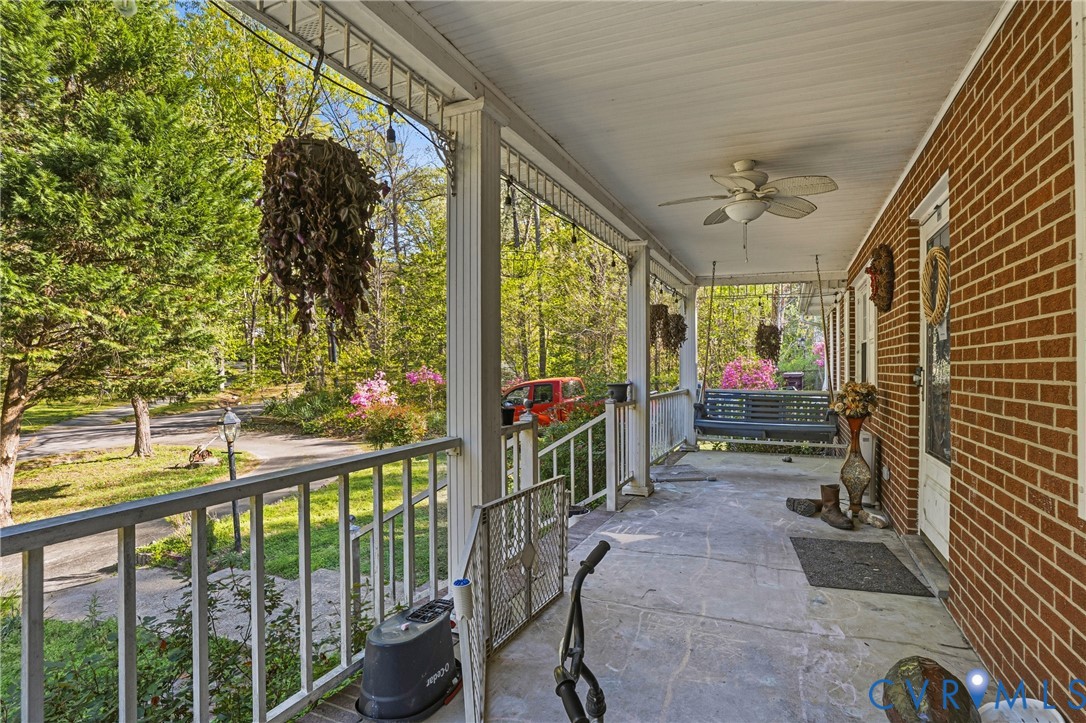 14219 Spruce Avenue Chester, VA 23836 - Photo 32 of 32 a view of a porch with a table and chairs
