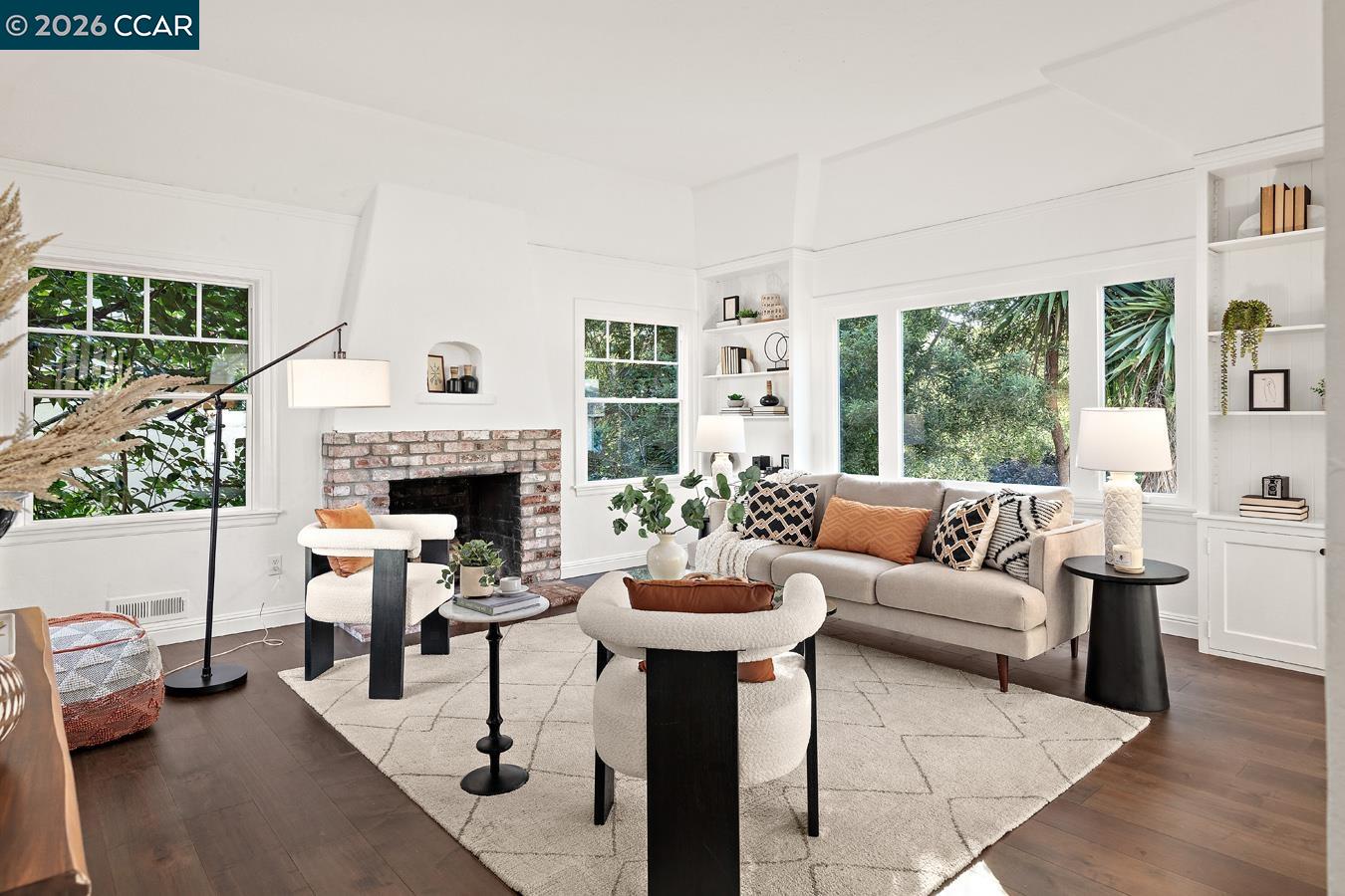 85 Ardmore Road Kensington, CA 94707 - Photo 4 of 45 a living room with furniture a fireplace and a large window