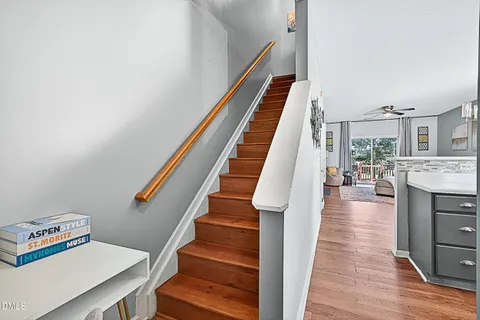 a view of entryway and hall with wooden floor