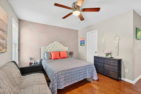 a bedroom with a bed and dresser