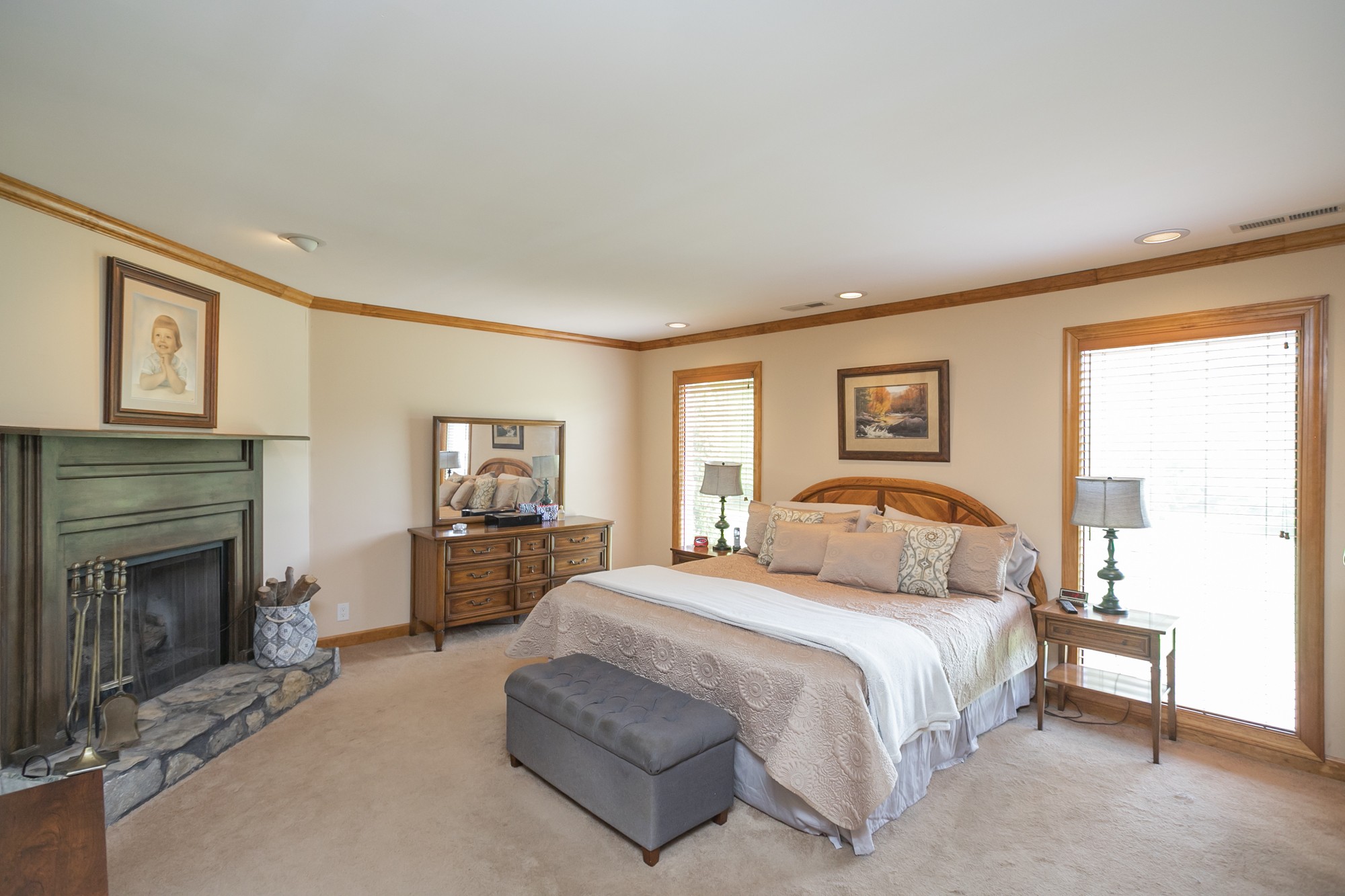 1249 Lock 4 Road Gallatin, TN 37066 - Photo 12 of 49 a bedroom with a bed and a fireplace