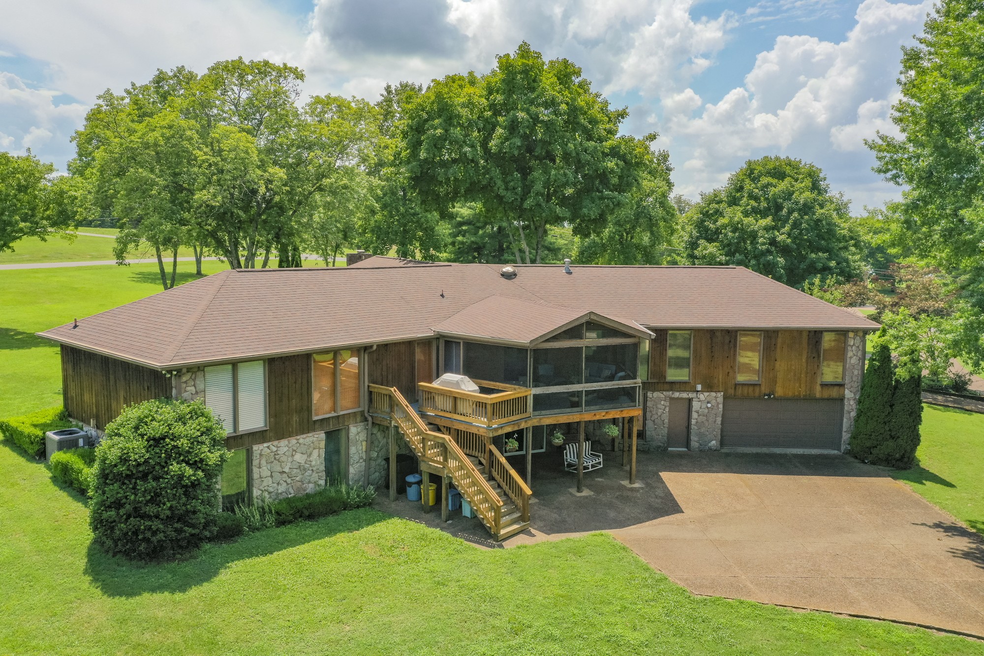 1249 Lock 4 Road Gallatin, TN 37066 - Photo 36 of 49 a view of a house with a yard porch and sitting area