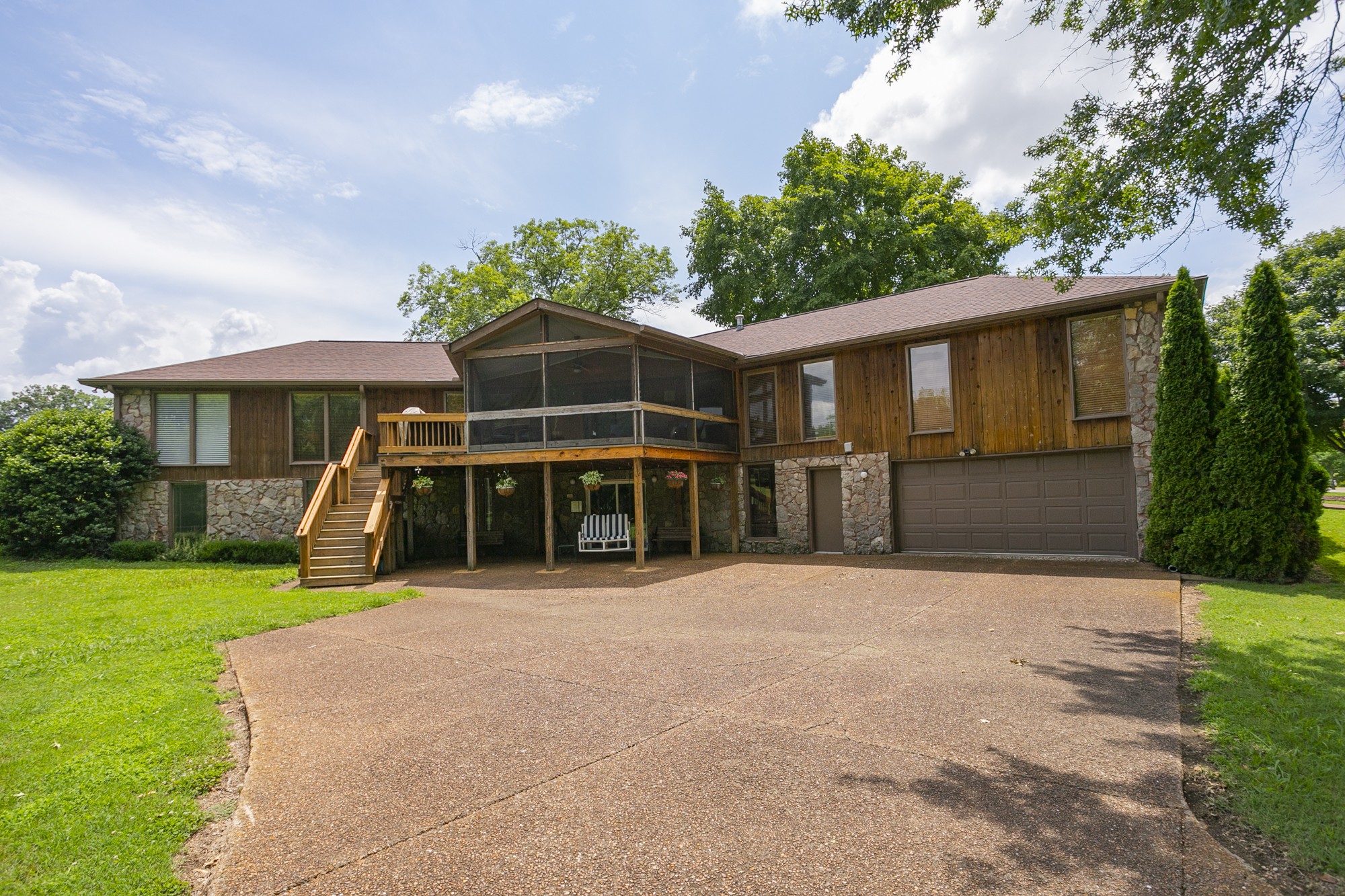 1249 Lock 4 Road Gallatin, TN 37066 - Photo 40 of 49 a view of a house with backyard porch and sitting area