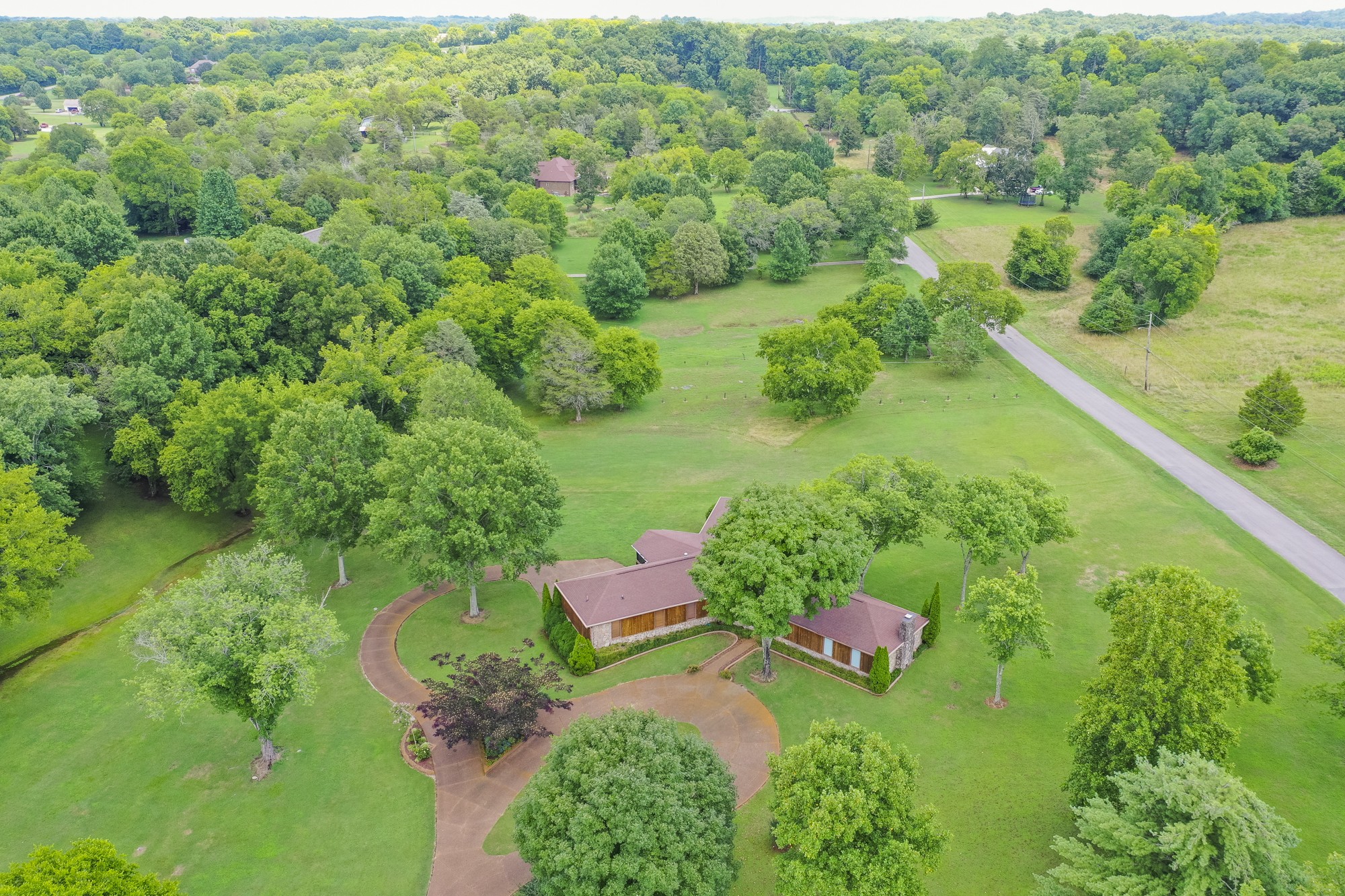 1249 Lock 4 Road Gallatin, TN 37066 - Photo 49 of 49 a view of a garden with a lake