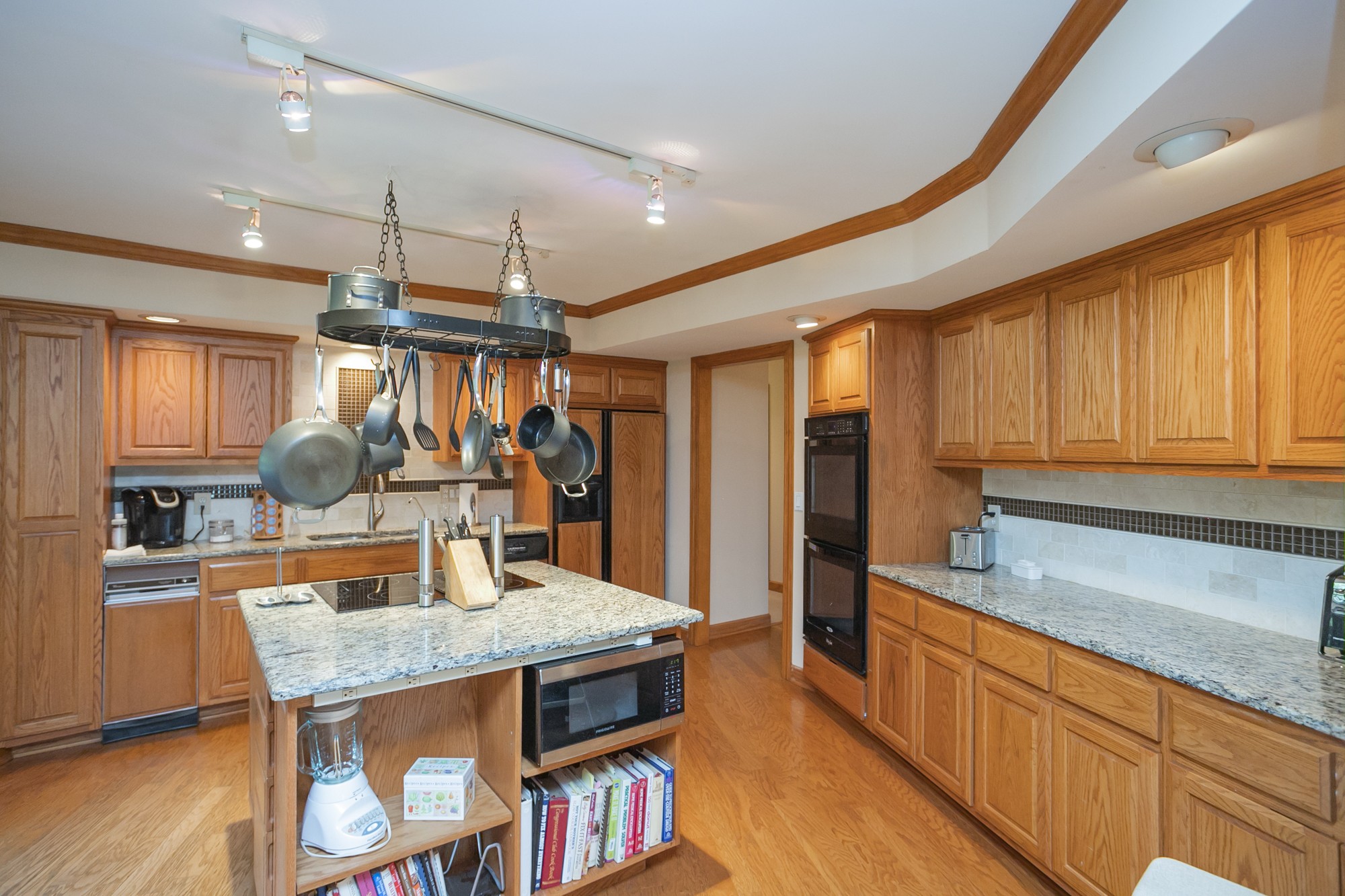 1249 Lock 4 Road Gallatin, TN 37066 - Photo 8 of 49 a kitchen with stainless steel appliances granite countertop a sink refrigerator and cabinets
