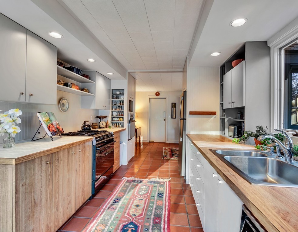 79 Lincoln Road Wayland, MA 01778 - Photo 8 of 28 a kitchen with stainless steel appliances granite countertop a sink stove and refrigerator