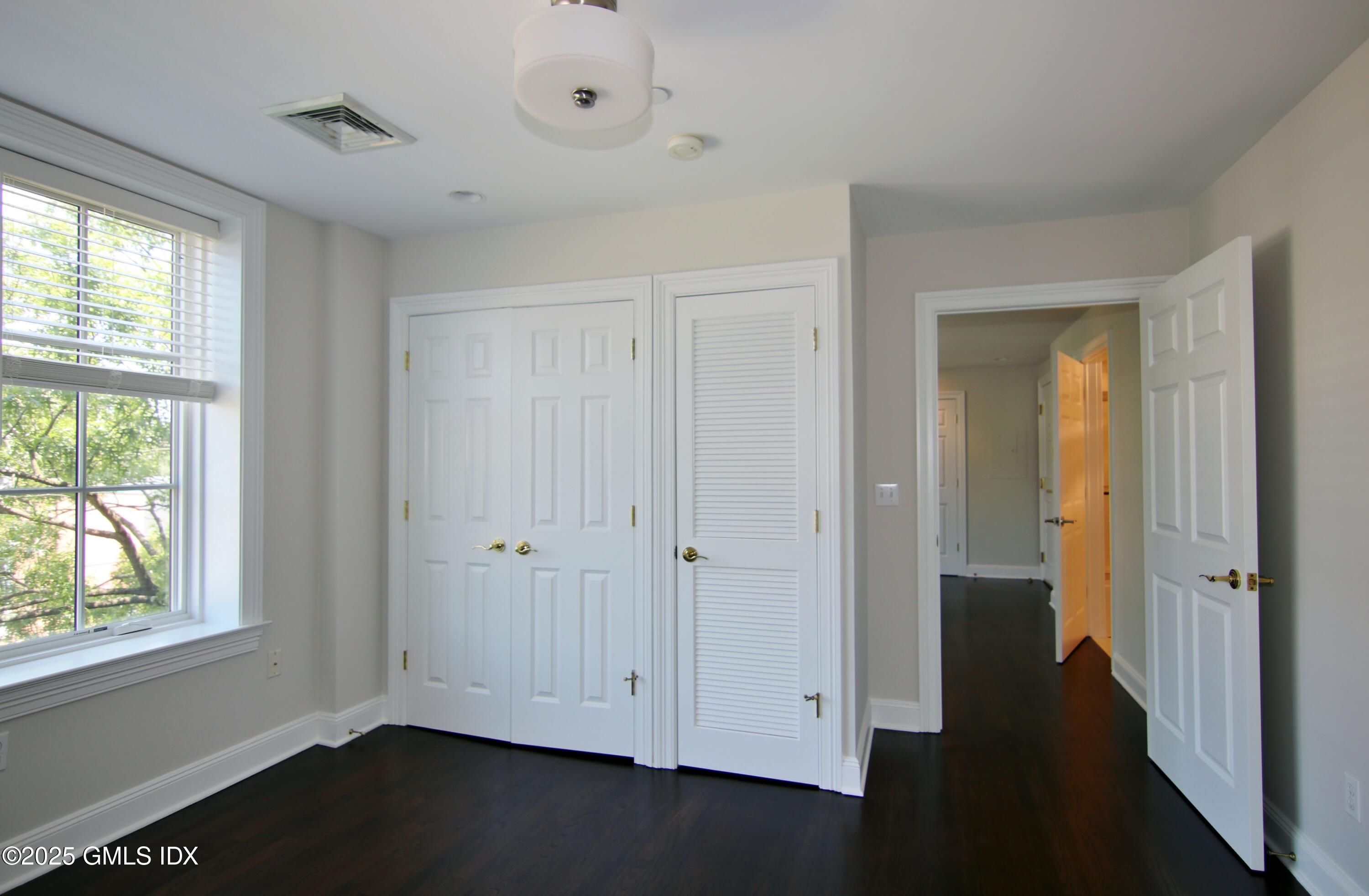 2 East Elm Street, Unit 31 Greenwich, CT 06830 - Photo 11 of 21 a view of empty room with window