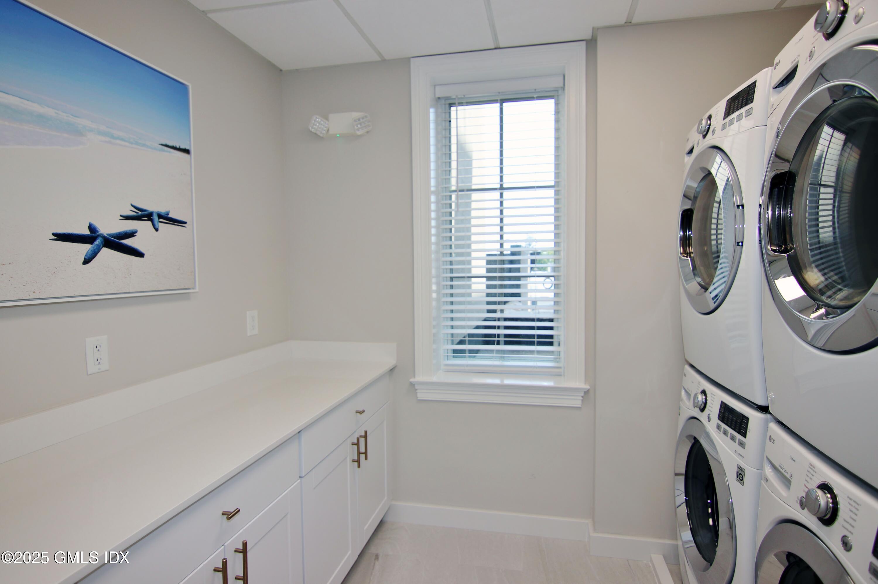 2 East Elm Street, Unit 31 Greenwich, CT 06830 - Photo 21 of 21 a utility room with multiple dryer and washer