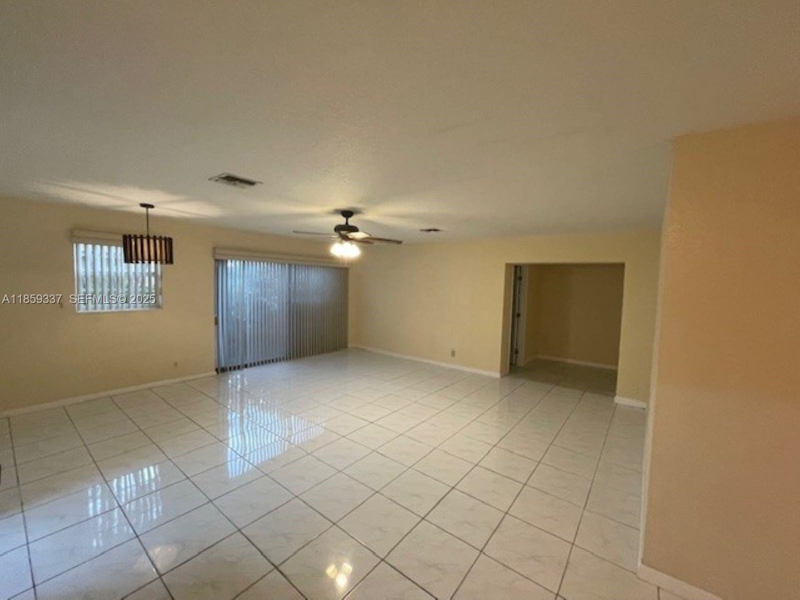 4831 Northwest 12th Street Lauderhill, FL 33313 - Photo 9 of 19 a view of an empty room with a window