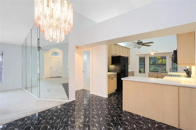 a room with a bed and a television