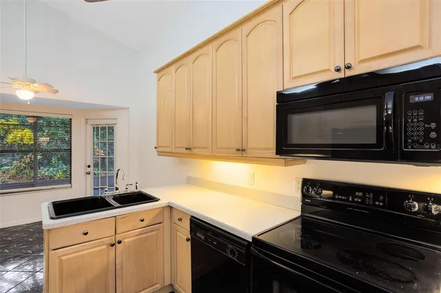 a kitchen with a stove and a microwave