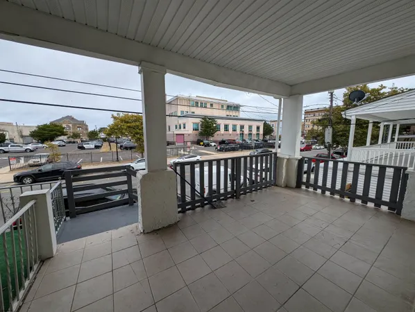 a view of a porch with furniture