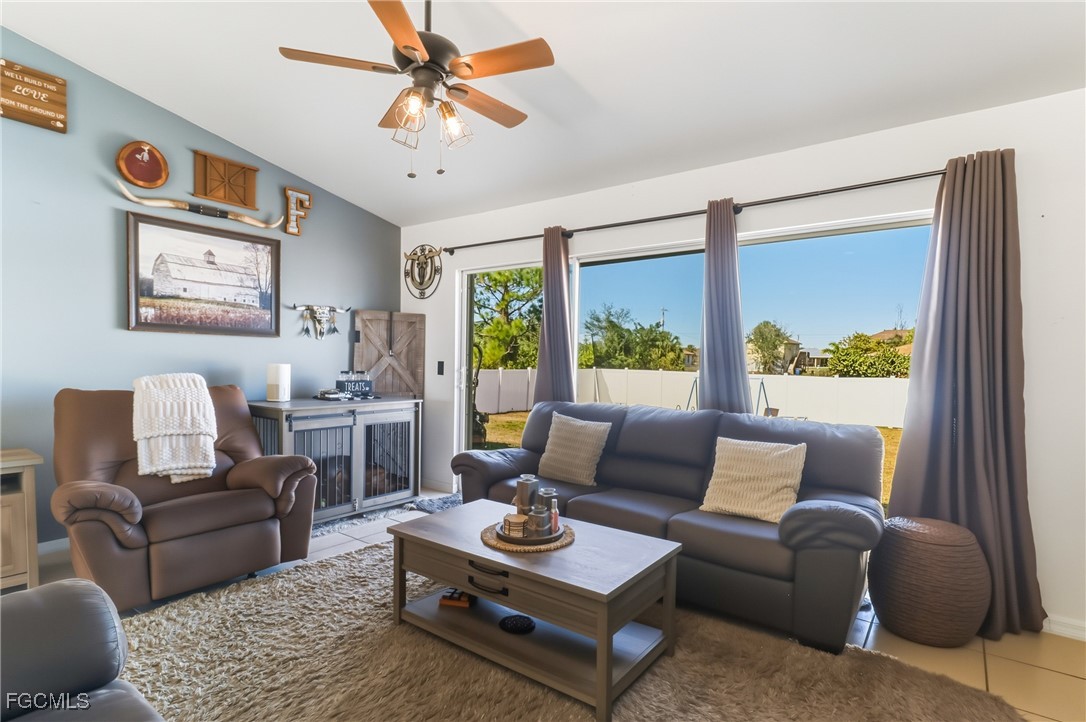 3910 23rd Street Southwest Lehigh Acres, FL 33976 - Photo 13 of 29 a living room with furniture and a large window