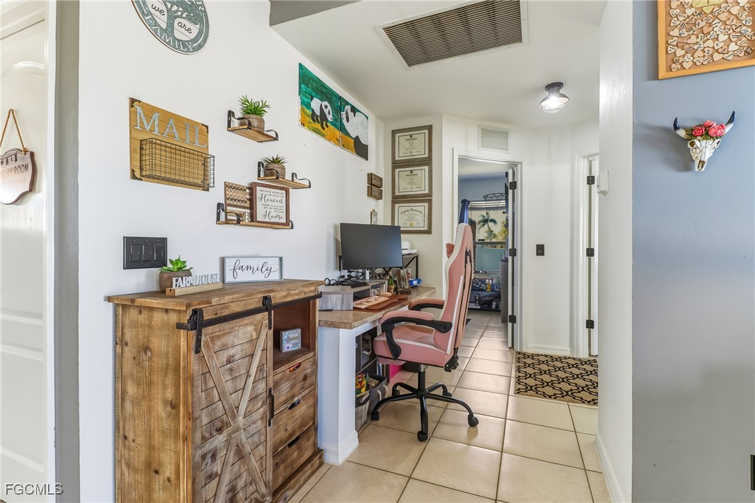3910 23rd Street Southwest Lehigh Acres, FL 33976 - Photo 16 of 29 a view of workspace with wooden floor