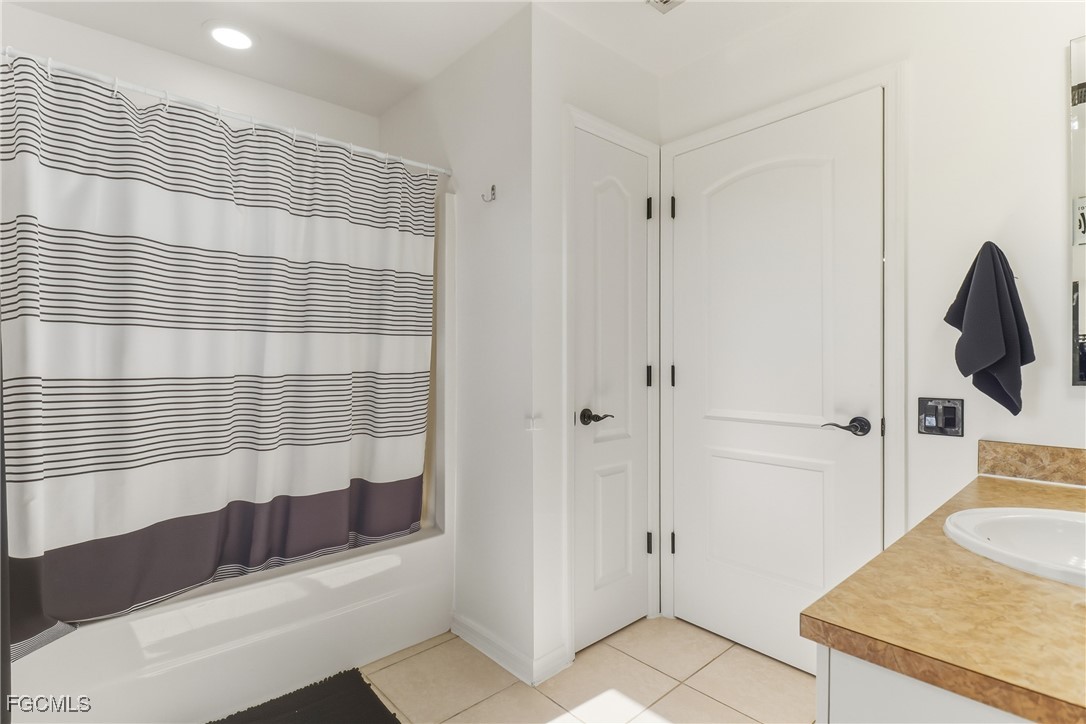 3910 23rd Street Southwest Lehigh Acres, FL 33976 - Photo 21 of 29 a bathroom with a sink and a shower
