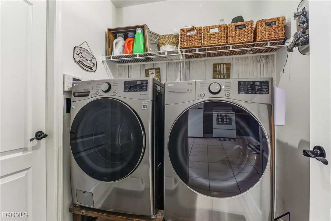 3910 23rd Street Southwest Lehigh Acres, FL 33976 - Photo 26 of 29 a utility room with dryer and washer