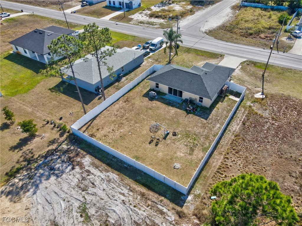 3910 23rd Street Southwest Lehigh Acres, FL 33976 - Photo 27 of 29 swimming pool with a bench
