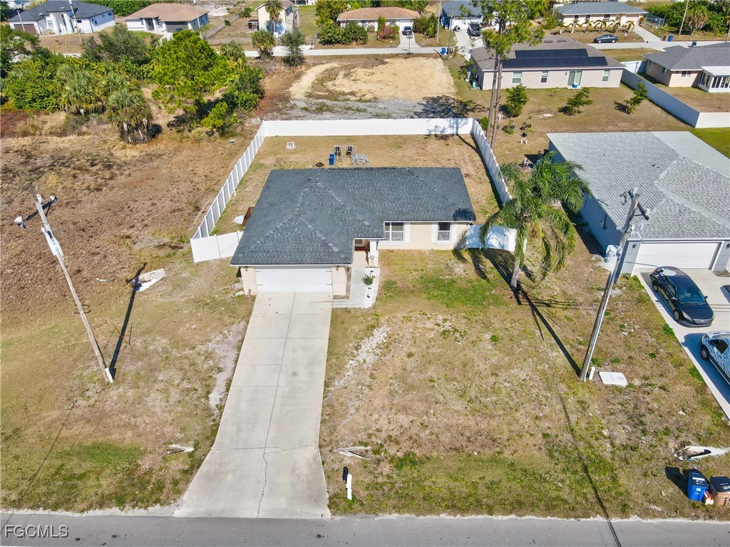 3910 23rd Street Southwest Lehigh Acres, FL 33976 - Photo 29 of 29 an aerial view of a house with swimming pool