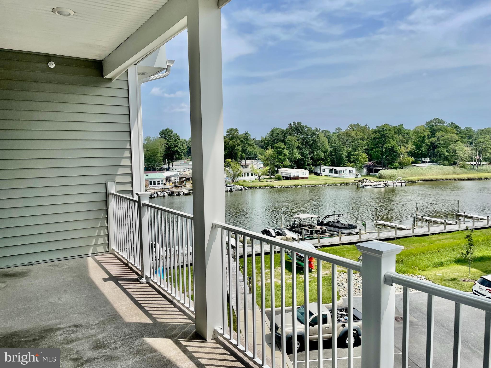 33707 Skiff Alley, Unit 6309 Lewes, DE 19958 - Photo 2 of 11 a view of a balcony with two chairs