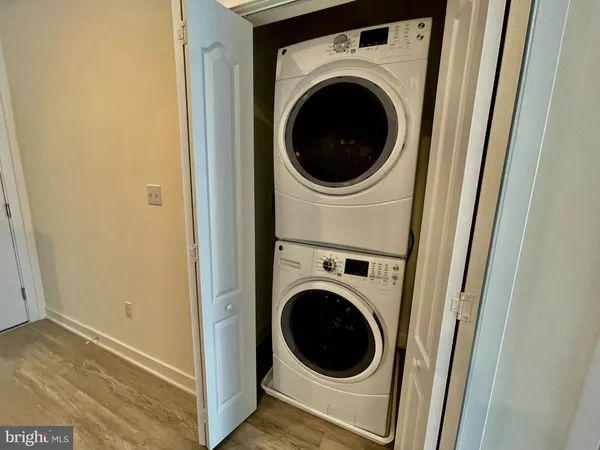 a view of a hallway with washer and dryer