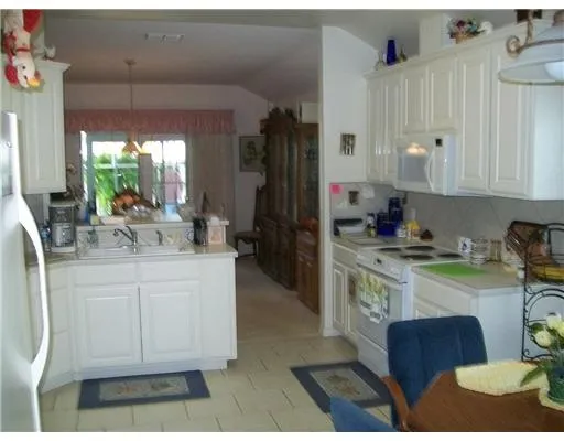 a kitchen with sink cabinets and outdoor view