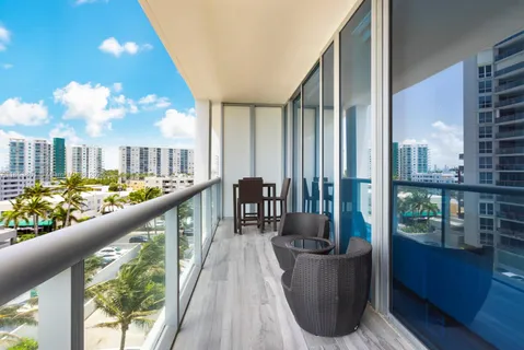 a view of balcony with furniture