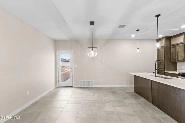 a view of a kitchen with a sink