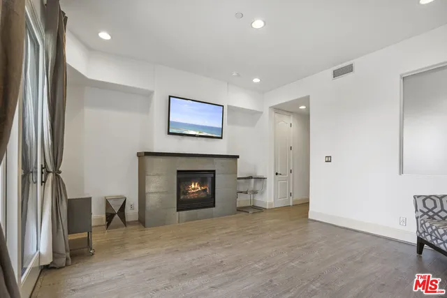 a view of a chairs and table in the balcony