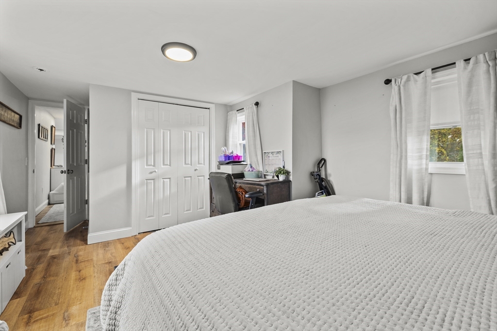 90 R Bartlett Road Plymouth, MA 02360 - Photo 15 of 35 a bed room with a bed and a mirror