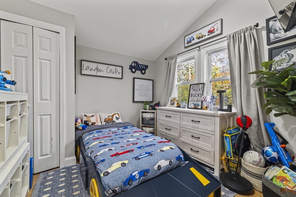 90 R Bartlett Road Plymouth, MA 02360 - Photo 17 of 35 a bedroom with a bed and a dresser in it