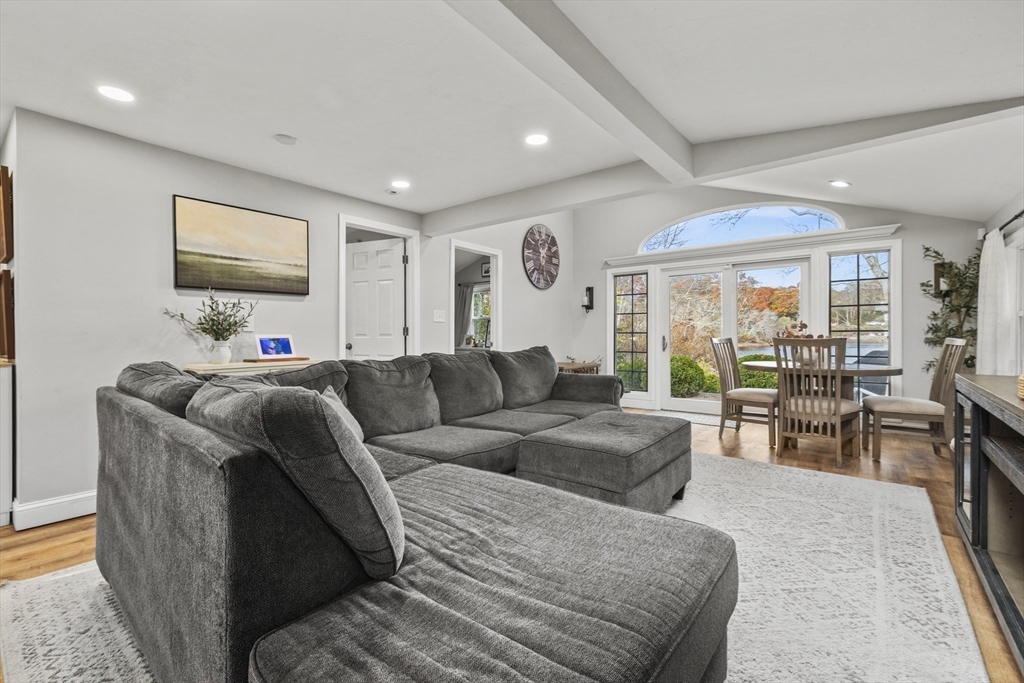 90 R Bartlett Road Plymouth, MA 02360 - Photo 20 of 35 a living room with furniture and a flat screen tv