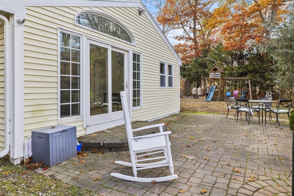 90 R Bartlett Road Plymouth, MA 02360 - Photo 22 of 35 a backyard of a house with barbeque oven table and chairs