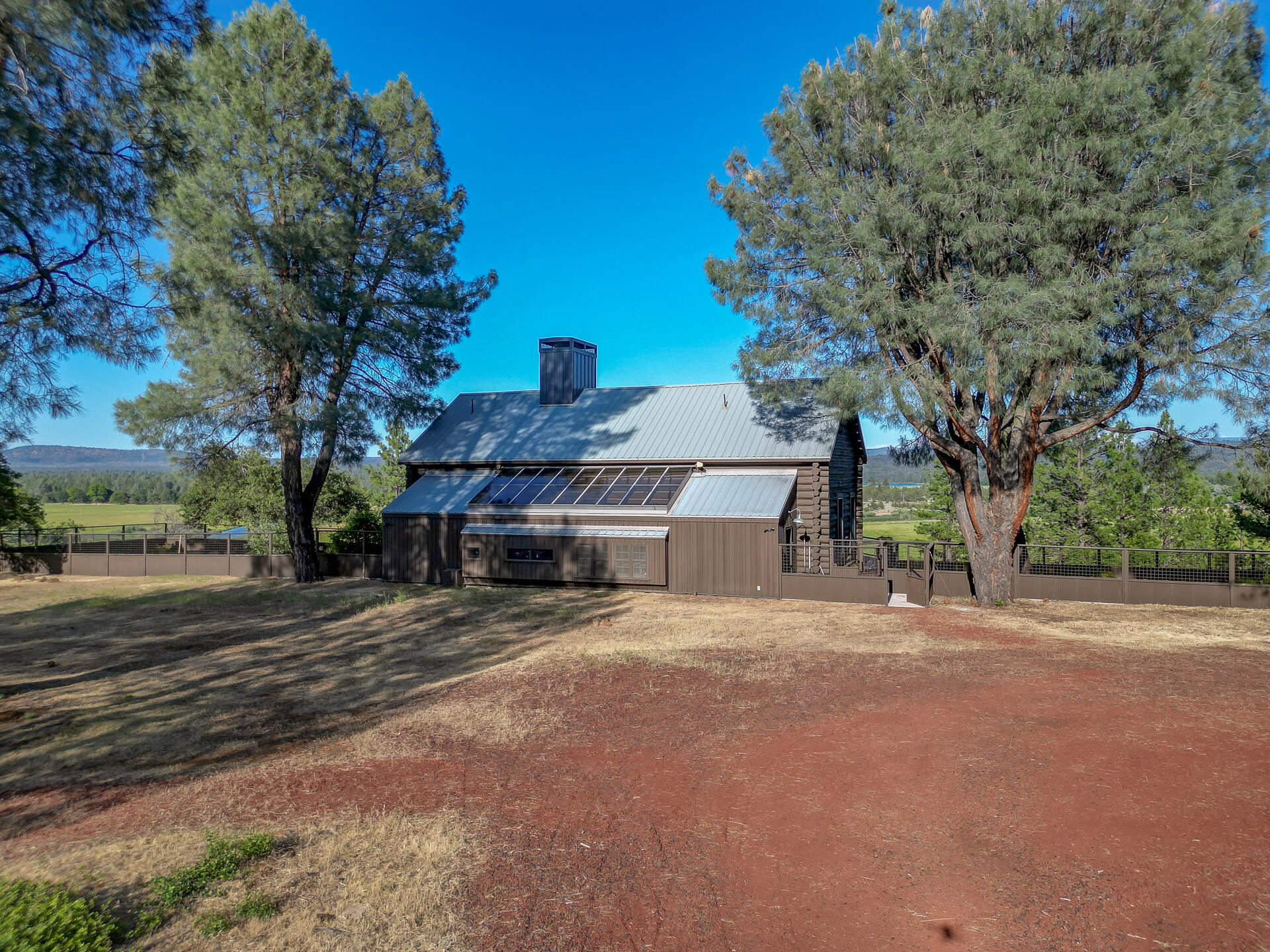 21151 Ridge Road Hat Creek, CA 96040 - Photo 15 of 68 a view of a house with a yard and tree