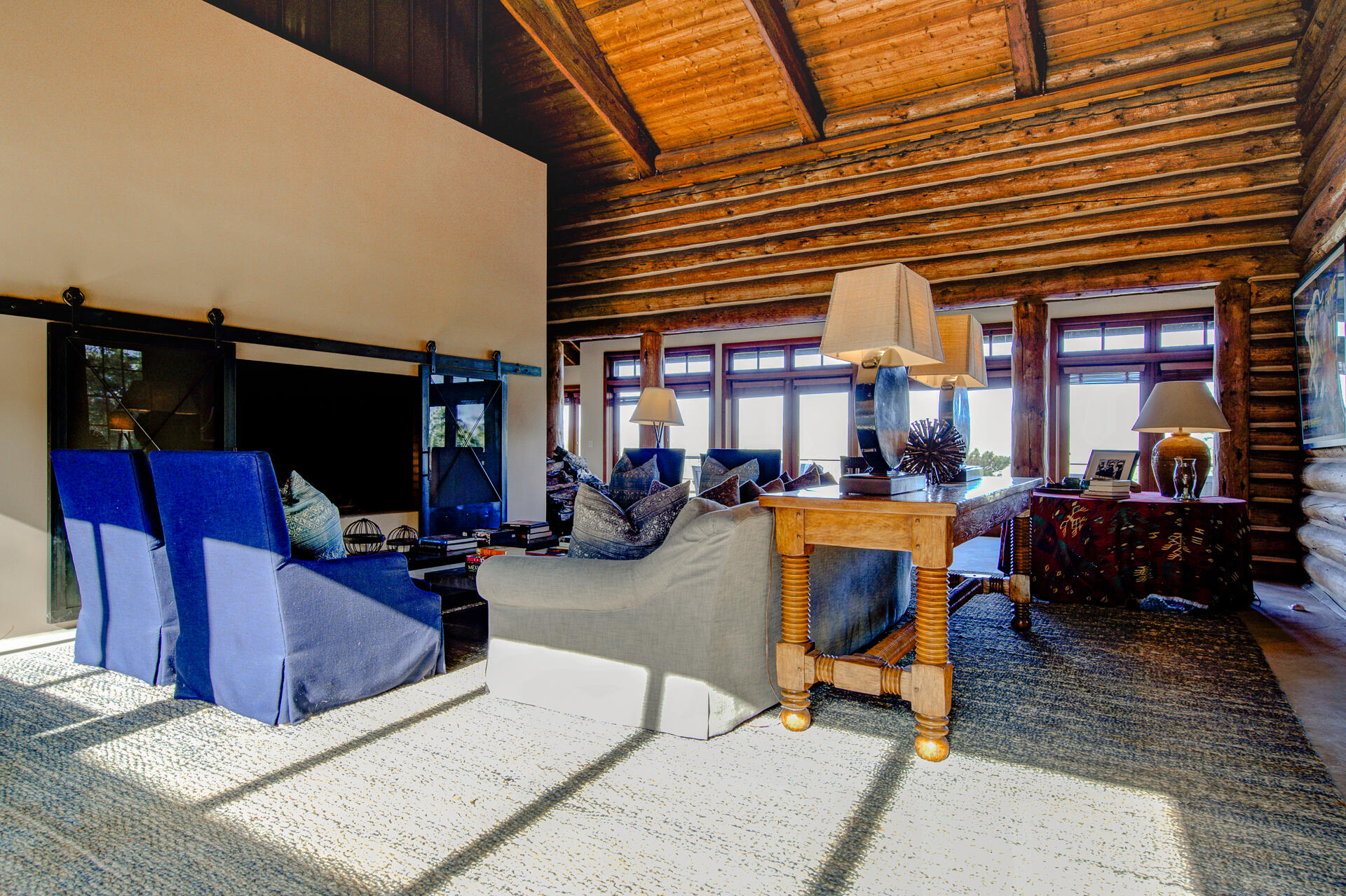 21151 Ridge Road Hat Creek, CA 96040 - Photo 16 of 68 a living room with furniture a flat screen tv and a fireplace