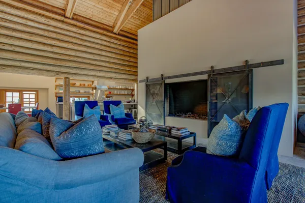 a large kitchen with stainless steel appliances double vanity sink and wooden floor