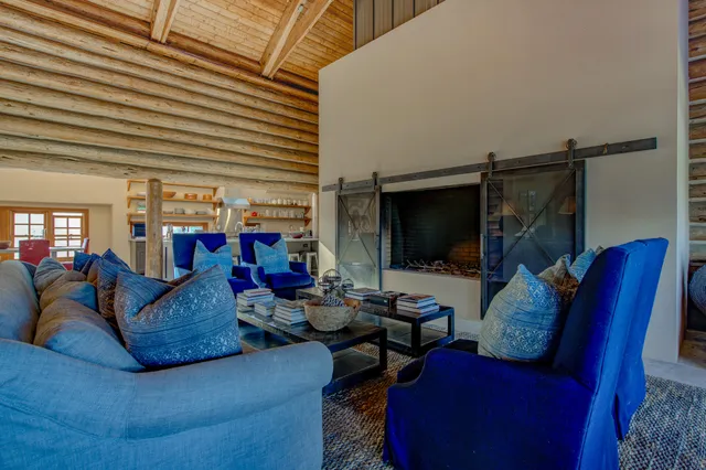 a large kitchen with stainless steel appliances double vanity sink and wooden floor