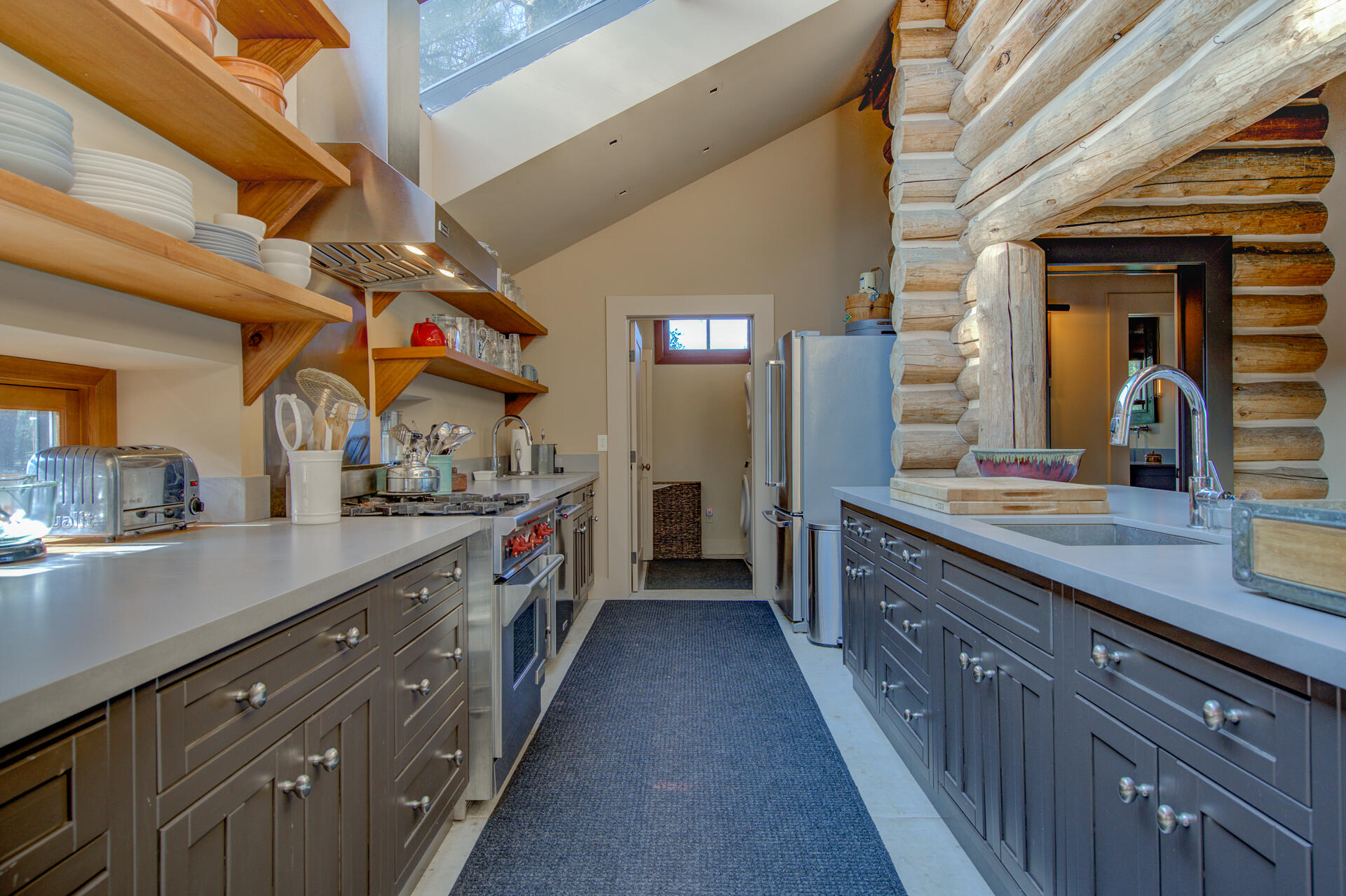 21151 Ridge Road Hat Creek, CA 96040 - Photo 23 of 68 a large kitchen with stainless steel appliances double vanity sink and wooden floor